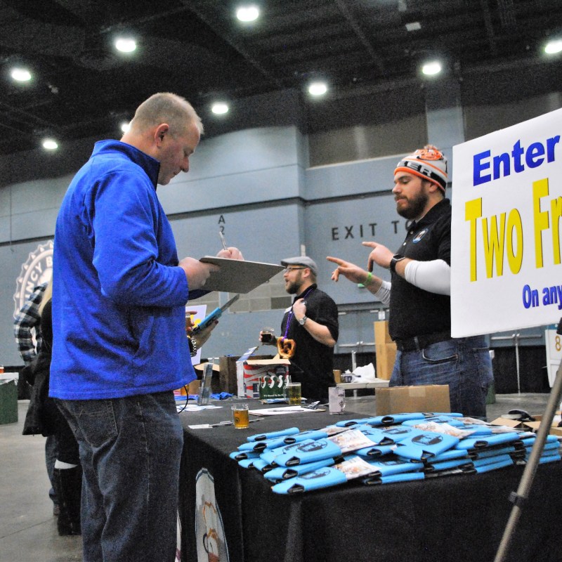 a man and a woman standing in front of a building
