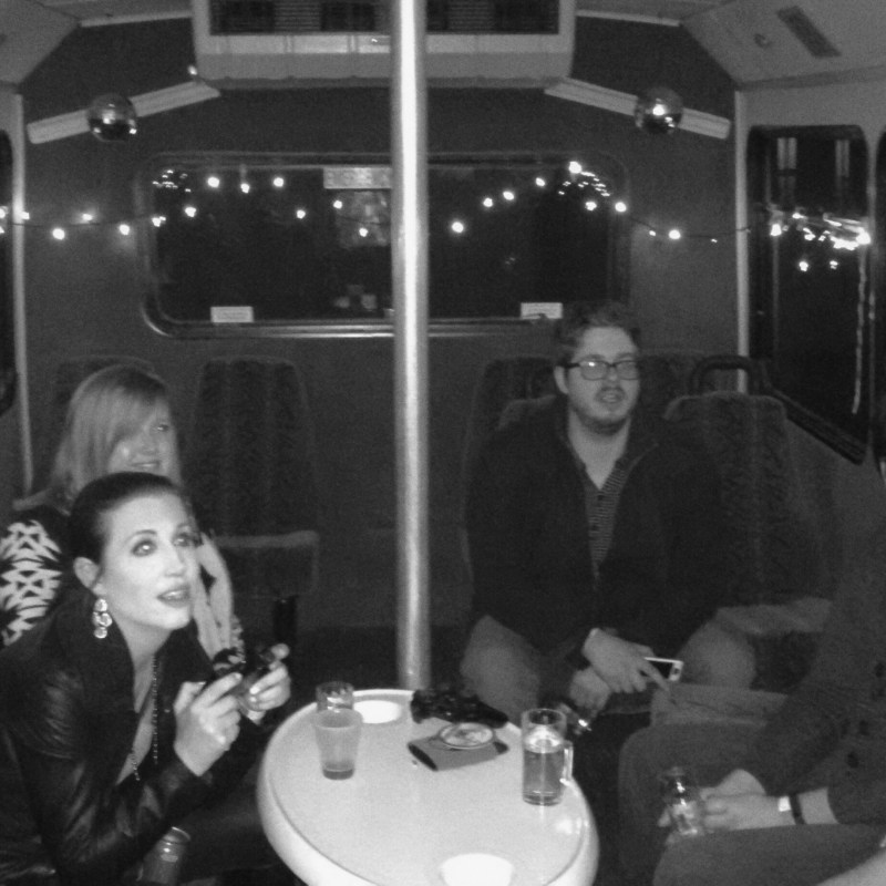 a group of people sitting at a table posing for the camera